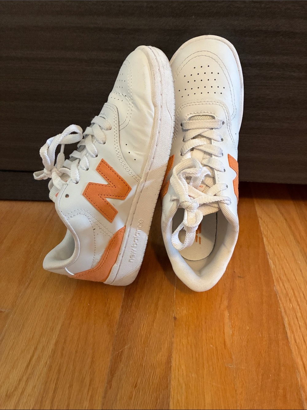 New Balance orange and white trainers